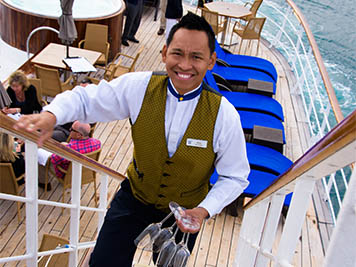 Ship crew member walking up stairs