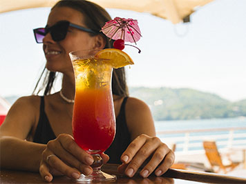 Woman enjoying a tropical drink